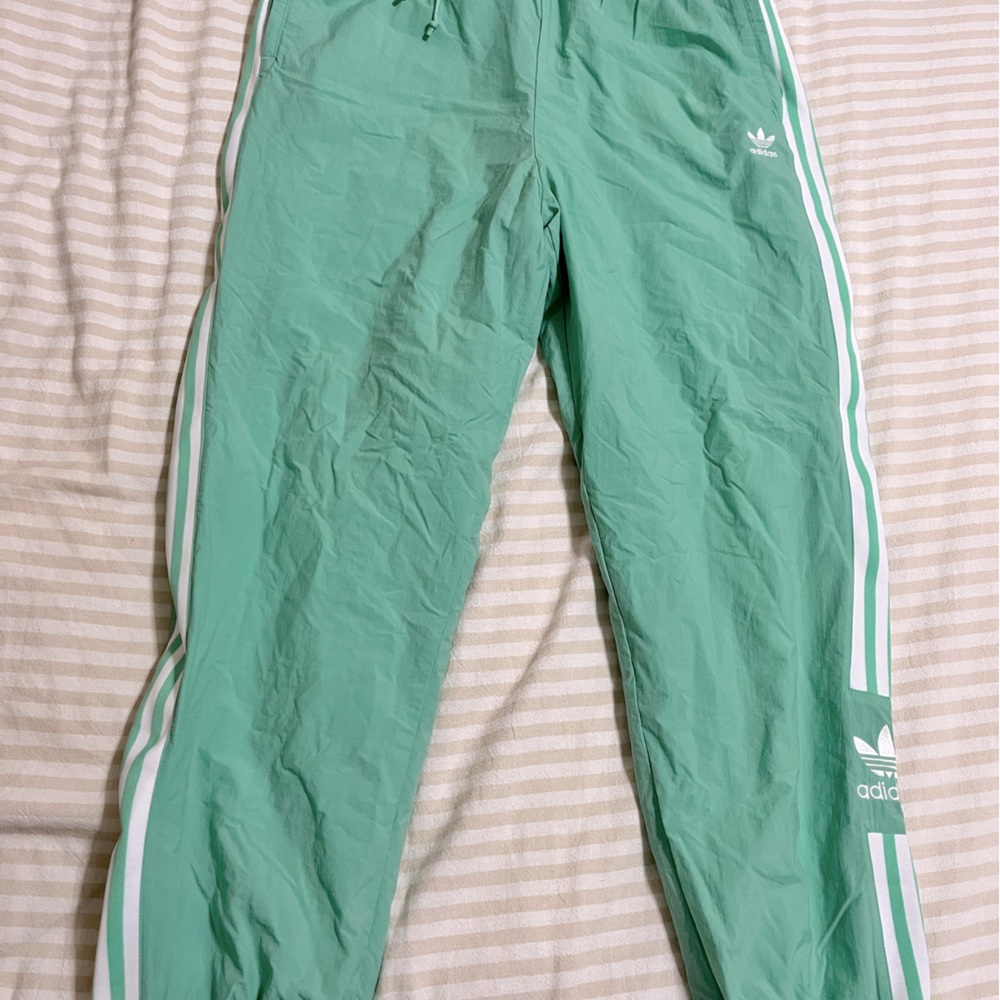 Mint green adidas track pants